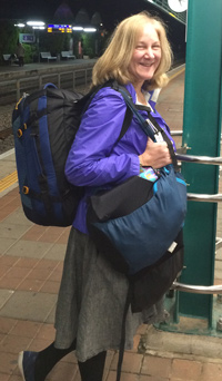 Deborah Shadovitz with full luggage, traveling in Haifa
